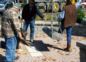 Milligan memorials employees setting the base stone along with Bill Albert Excavating employees. Crane was provided by Bill Albert Excavating. October 18, 2013.