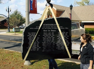 Bill Albert Excavating crane lifting the Memorial Stone off of the truck for placement. October 18, 2013.